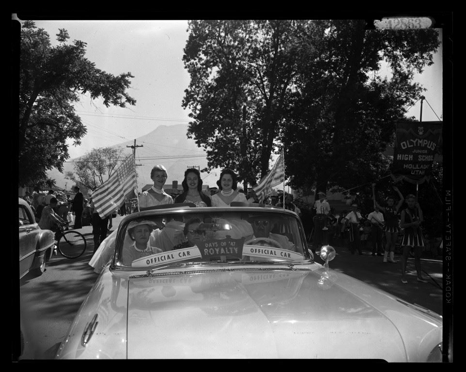 Picture of Millcreek royalty riding in Official Royalty Car in East Millcreek Parade